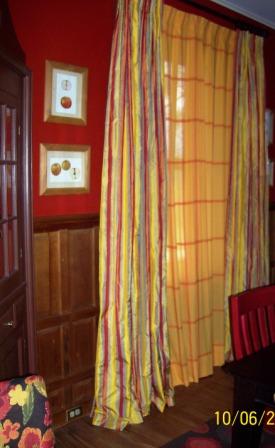 Striped silk drapes, lined and interlined, over checked cotton sheers.